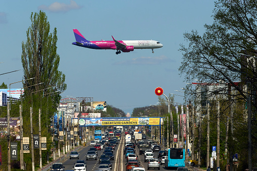 Otopeni, Romania. 8th Apr, 2024: Flight Paris to Bucharest, W43052, of the low cost airline Wizz Air lands at Bucharest Henri Coanda International Airport (AIHCB), over the National Road no. 1 in Otopeni, 16.5 km north of Bucharest.