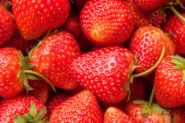 istock Fresh organic red strawberry fruit background 2147647433