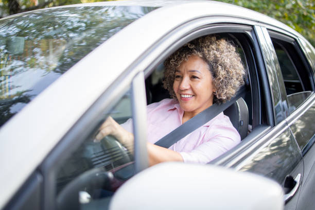 istock Woman is driving a car on her way to work 2147647445