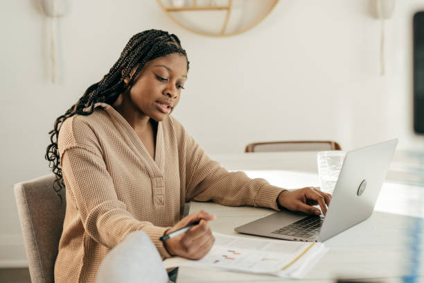 istock Laptop and Learning: Teen's Home Workspace Becomes a Beacon of Academic Achievement 2147647801