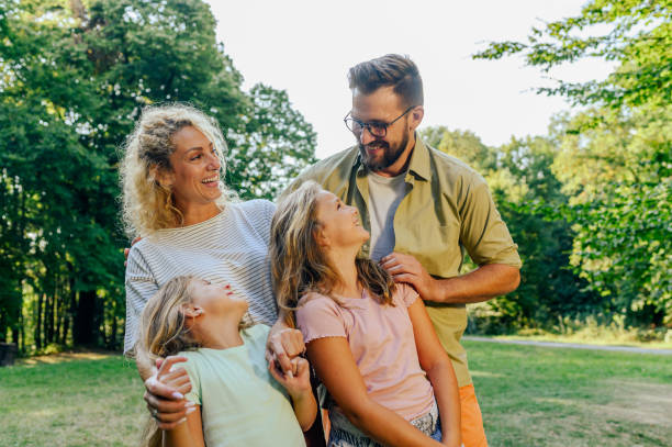 istock Close up of a cheerful family hugging while standing in nature. 2147648548