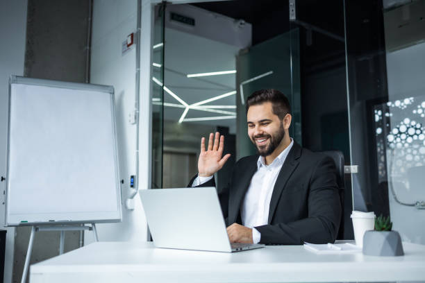 istock Happy mature business man executive manager looking at laptop computer watching online webinar or having remote virtual meeting, video conference call negotiation corporate training working in office. 2147648726