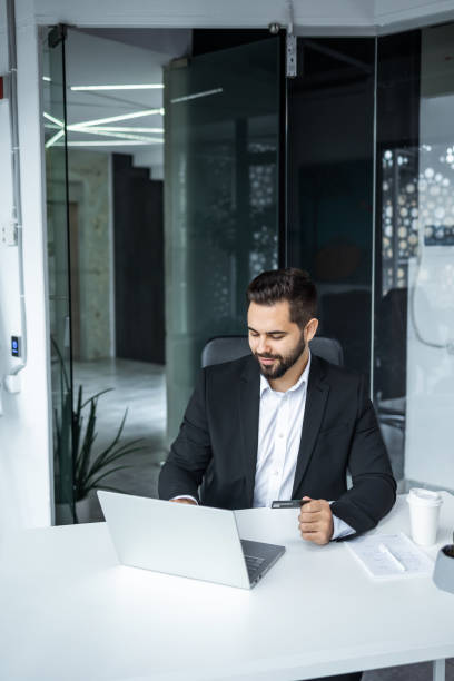 istock businessman having online virtual meeting call on laptop looking at screen sitting at table in coworking creative office 2147648738