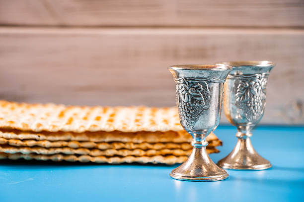 istock Happy passover. Metal goblet and traditional matzah on blue background. 2147651693