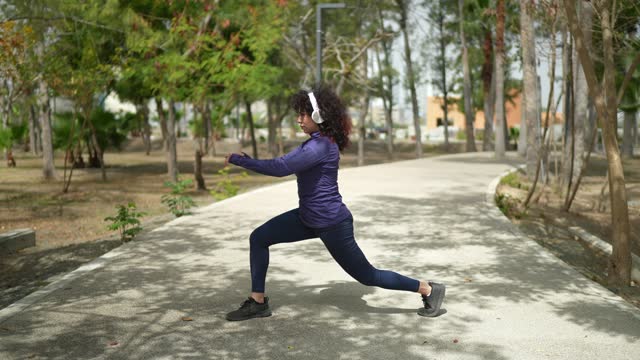 Young woman stretching on the public park