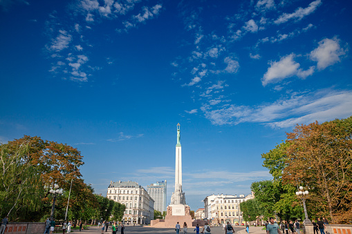 Riga, Latvia - August 25, 2023: Picture of the freedom monument of Riga, latvia. The Freedom Monument (or: Brivibas piemineklis) is a monument located in Riga, Latvia, honouring soldiers killed during the Latvian War of Independence (19181920). It is considered an important symbol of the freedom, independence, and sovereignty of Latvia. Unveiled in 1935, the 42-metre (138 ft) high monument of granite, travertine, and copper often serves as the focal point of public gatherings and official ceremonies in Riga.