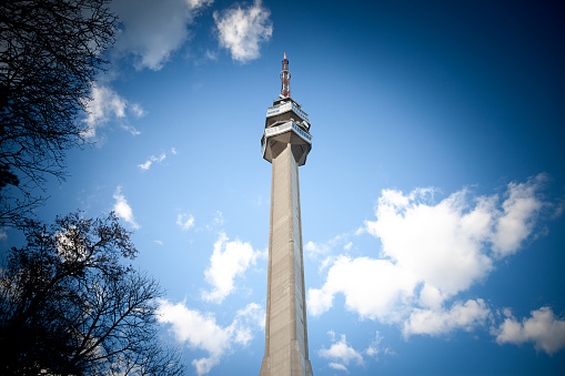 Picture of the Avala tower, or Avala toranj, seen from a nearby forest. It is a TV tower and broadcasting antenna in the suburbs of Belgrade, Serbia.
