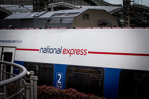 Cologne, Germany - November 6, 2022: Picture of a National Express train in Cologne Train station. National Express is an intercity and inter-regional coach operator providing services throughout Great Britain and Germany. It is a subsidiary of the British multinational public transport company Mobico Group. Most services are subcontracted to local coach companies