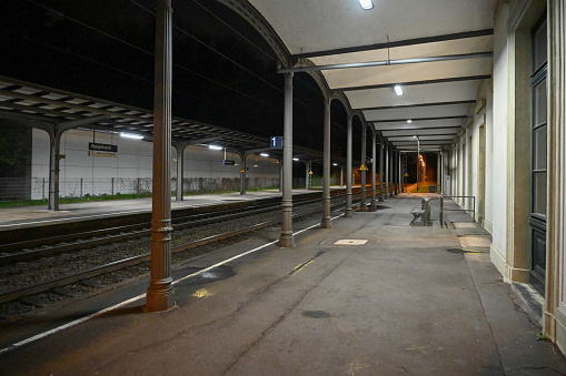 Remagen, Germany, March 30, 2024 - The illuminated train tracks at Rolandseck station at dusk.