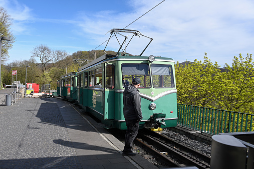 Remagen, Germany, March 31, 2024 - An electric railcar of the Drachenfelsbahn, a rack railroad connecting Königswinter on the Rhine with the summit of Drachenfels.