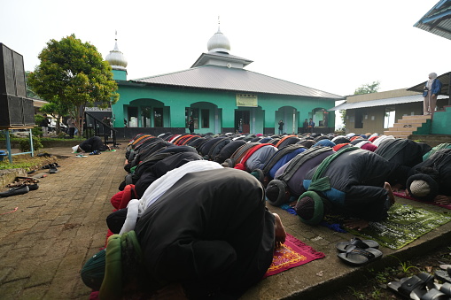 Gowa, Indonesia - April 9 2024: The An Nadzir congregation performs Eid prayers together in neat rows