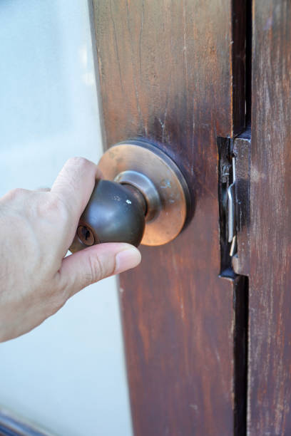 istock Man hand opens door knob,Hand open the door with a doorknob 2147659549