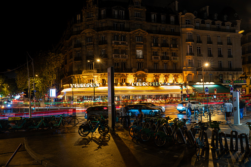Street at night with car traffic and L'Europeen restaurant in front of Paris-Lyon Station in the French capital. paris. France. August 11, 2023.