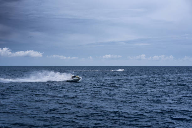 istock Jet ski racing on a srormy day in the sea 2147663084