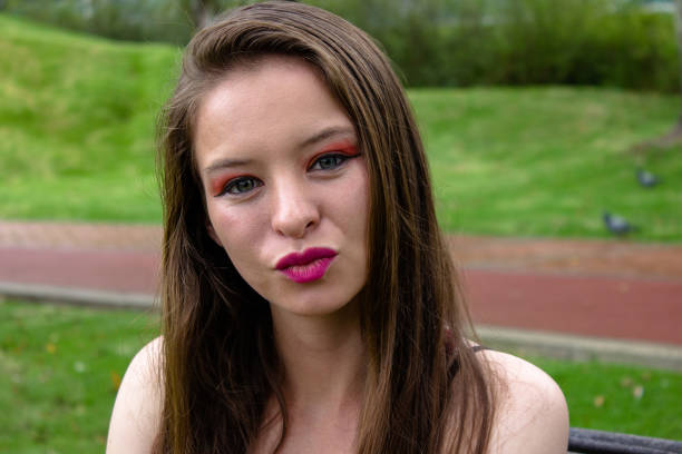 A pretty Filipino/White lady in her late 20s caught in an off-guarded moment.