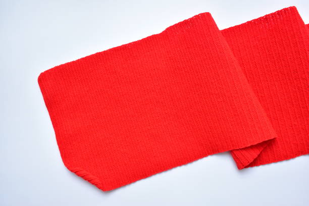 istock wavy of red wool knitted yarn texture, woolen fabric on white background 2147668020