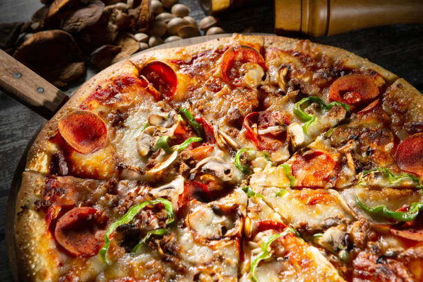 istock pizza with salami and olives 2147668317