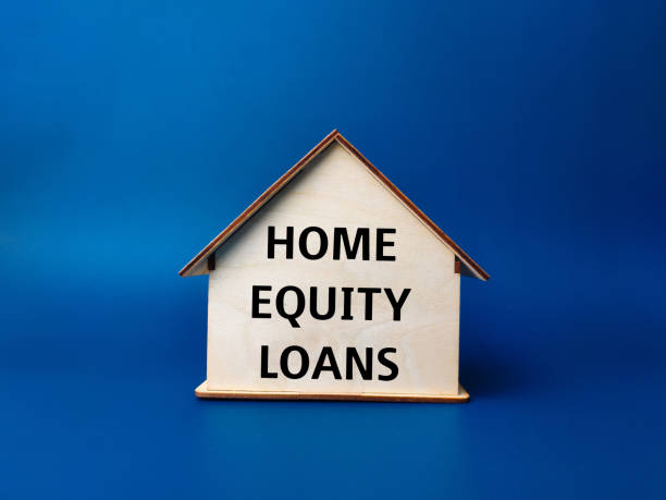 istock Wooden house with text HOME EQUITY LOANS 2147668513