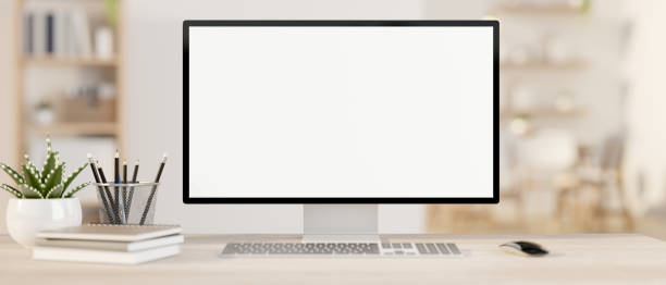 istock A computer mockup on a wooden table in a contemporary minimalist white office or home office. 2147669660
