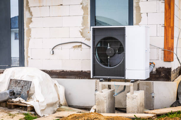 istock Air source heat pump installed outside of new and modern house under construction, green renewable energy concept 2147671192