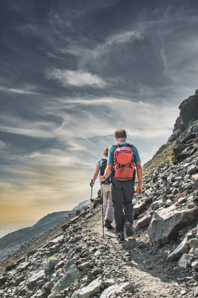istock A couple during an alpine trek 2147672149