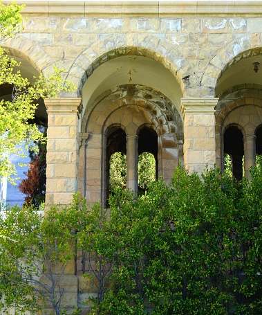 Archway windows that now belong to time. The stories echo on the breeze that once filled its hallways and courtyard.