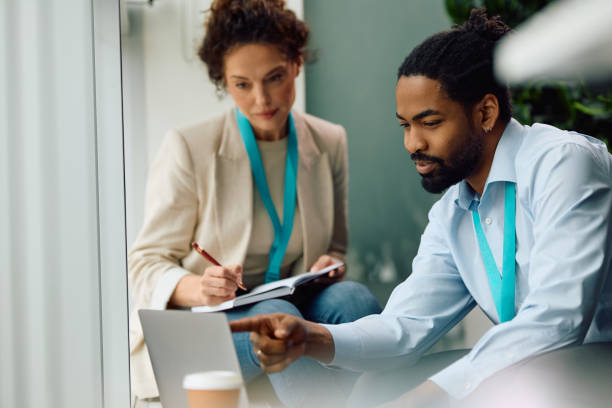 istock Business colleagues cooperating while working on laptop in the office. 2147673024