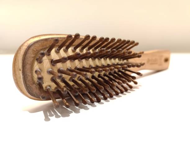 istock Brown wooden comb on white background. 2147673344