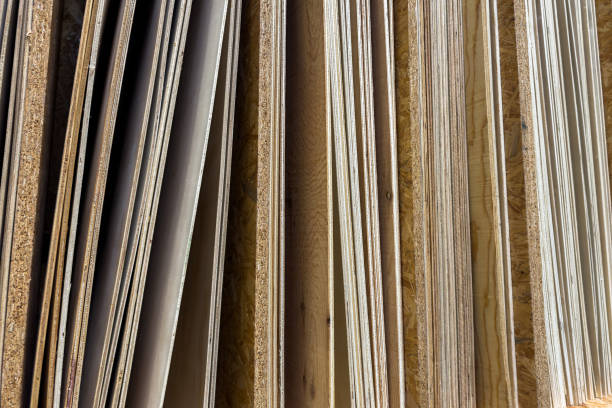 End view of plywood sheets of various thicknesses standing vertically. Close up.