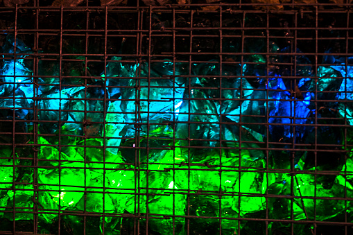 installation of luminous blue and green stones in the decoration of landscape design outside
