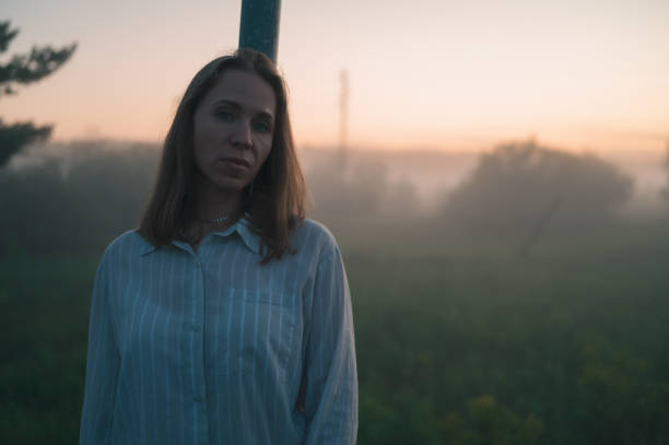 istock Woman in a field with fog 2147676642
