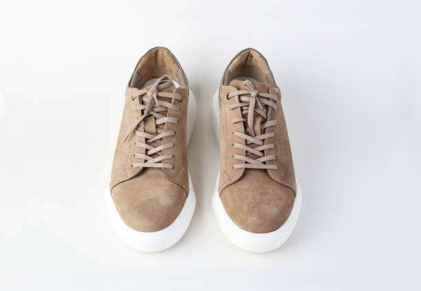 istock Pair of comfortable suede shoes on white background 2147677057