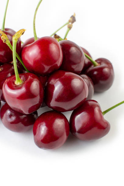istock ripe burgundy cherries on a white background 2147677295