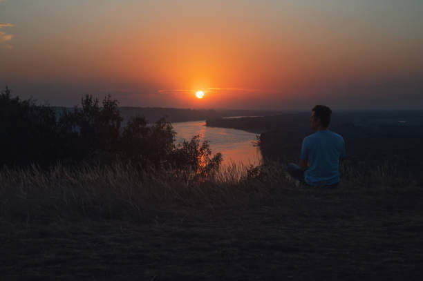 istock Man on the river coast landscape 2147677357