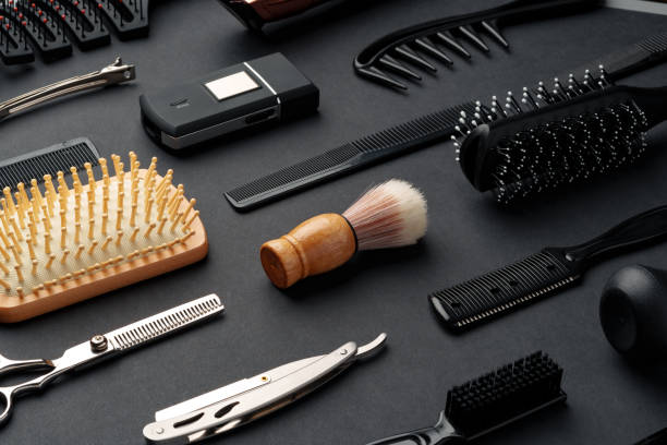 istock Variety of Hair Styling Tools and Accessories Displayed on a Dark Background 2147677615