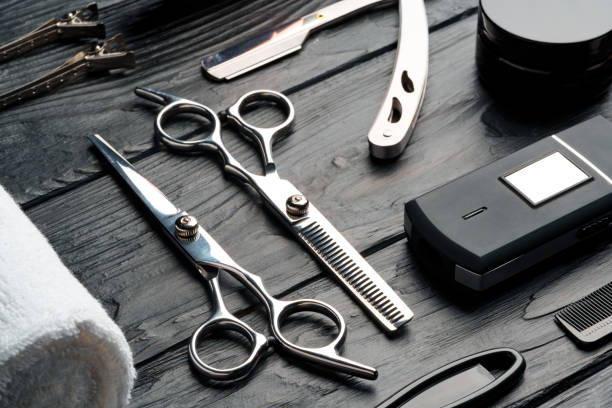 istock Professional Barber Tools Laid Out on Dark Wooden Surface 2147678006
