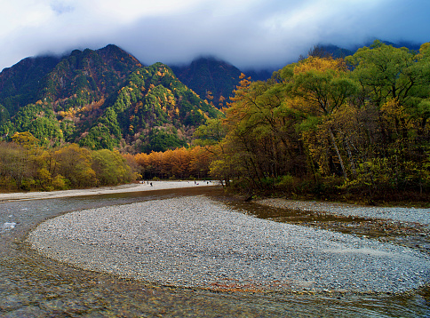 Kamikochi National Park in the Northern Japan Alps of Nagano Prefecture, Japan. Beautiful mountain in autumn leaf and Azusa river