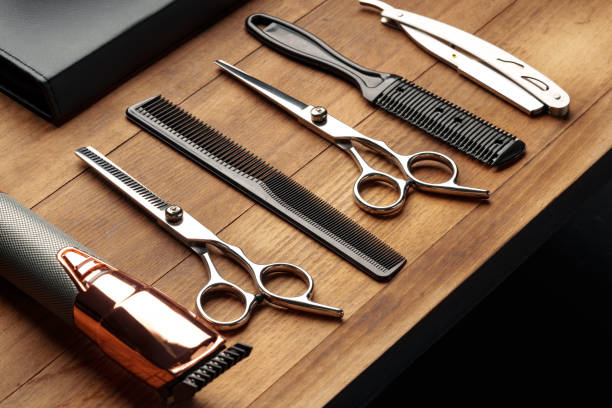 istock Professional Barber Tools Laid Out on Wooden Surface for Mens Grooming Session 2147678318