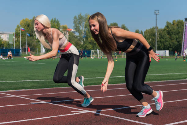 istock Two athlete young woman runnner at the stadium 2147678479