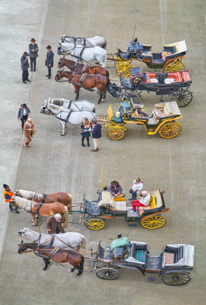 Salzburg, Austria -  October 5, 2022: The horse-drawn carriage park in Residence square, seen from the terrace of the Dom Quartier museum