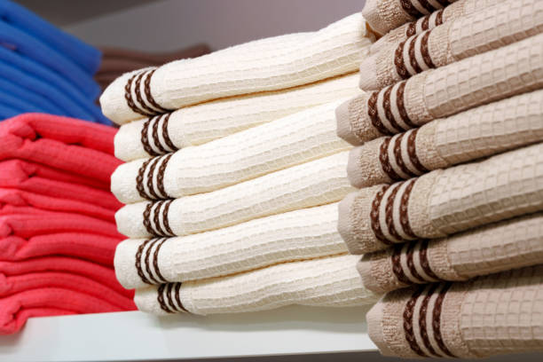 istock Stack of Neatly Folded White Towels on a Retail Store Shelf 2147679039