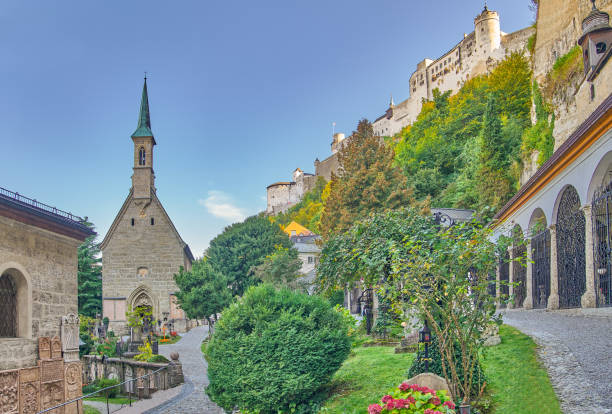 Salzburg, Austria -  October 6, 2022:  The chapel and the catacombs (right) of the  ancient St Peter cemetery