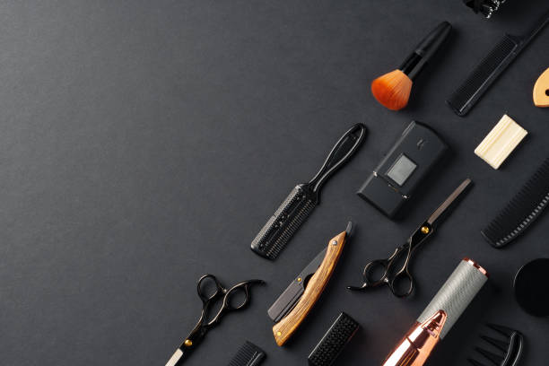 istock An Assortment of Professional Hairdressing Tools Laid Out on a Dark Surface 2147679374