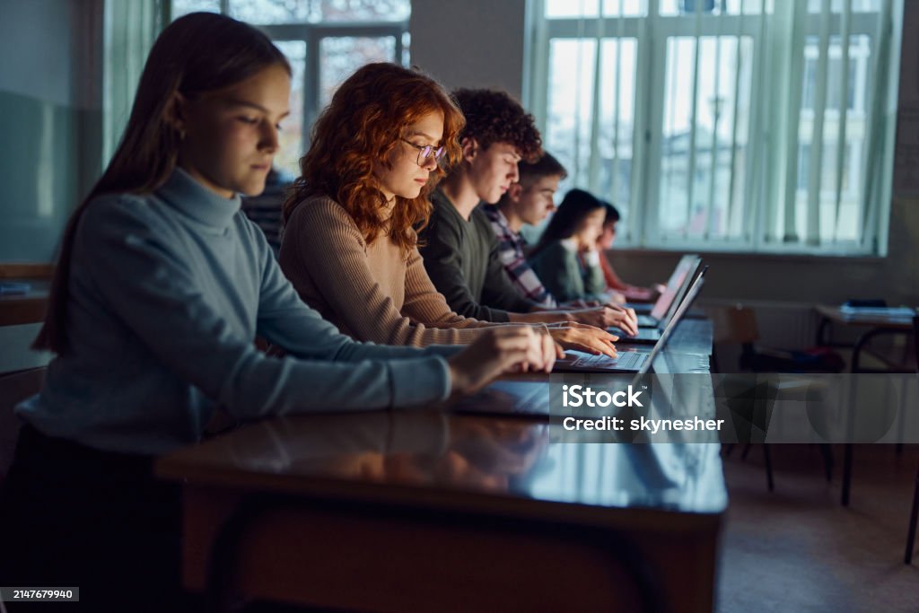 Students On Elearning Group Of Students Elearning Over Computers In The Classroom Stock Photo ...