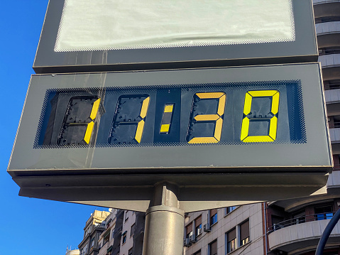 Low angle view of billboard showing 11:30 hours in the city of Valencia, Spain