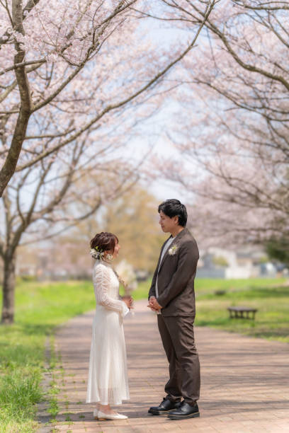 istock Casual wedding on a spring day when cherry blossoms bloom 2147680304