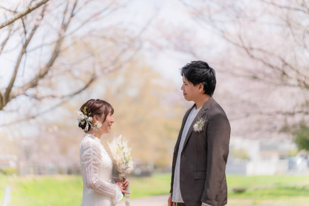 istock Casual wedding on a spring day when cherry blossoms bloom 2147680311
