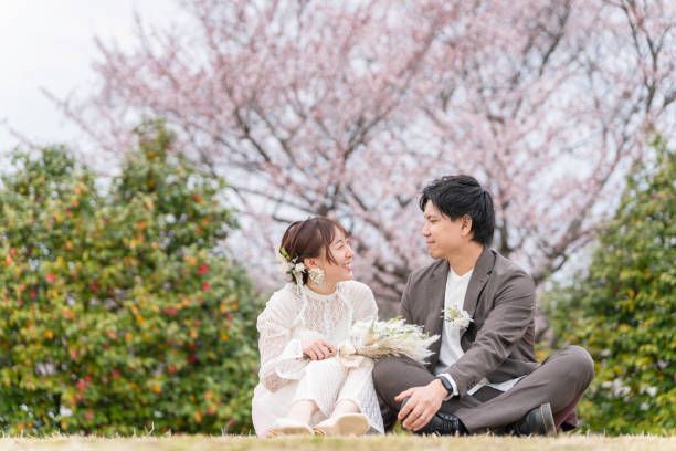istock Casual wedding on a spring day when cherry blossoms bloom 2147680350