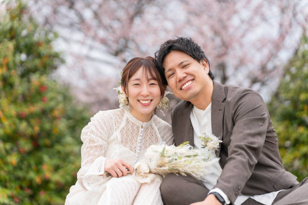 istock Casual wedding on a spring day when cherry blossoms bloom 2147680353