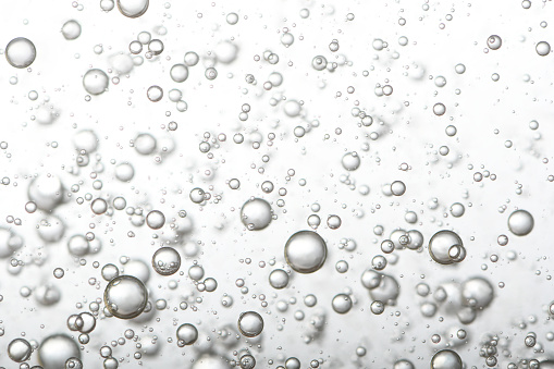 Pouring water, create a flow of water bubbles.